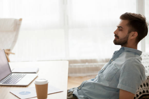 Person taking a short breathing break at a desk